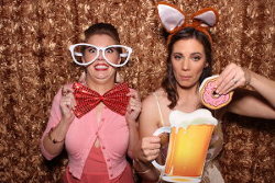 two friends in a photobooth hired in Adelaide