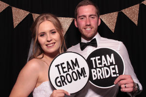 A bride and groom enjoying the FOTO Machines photobooth